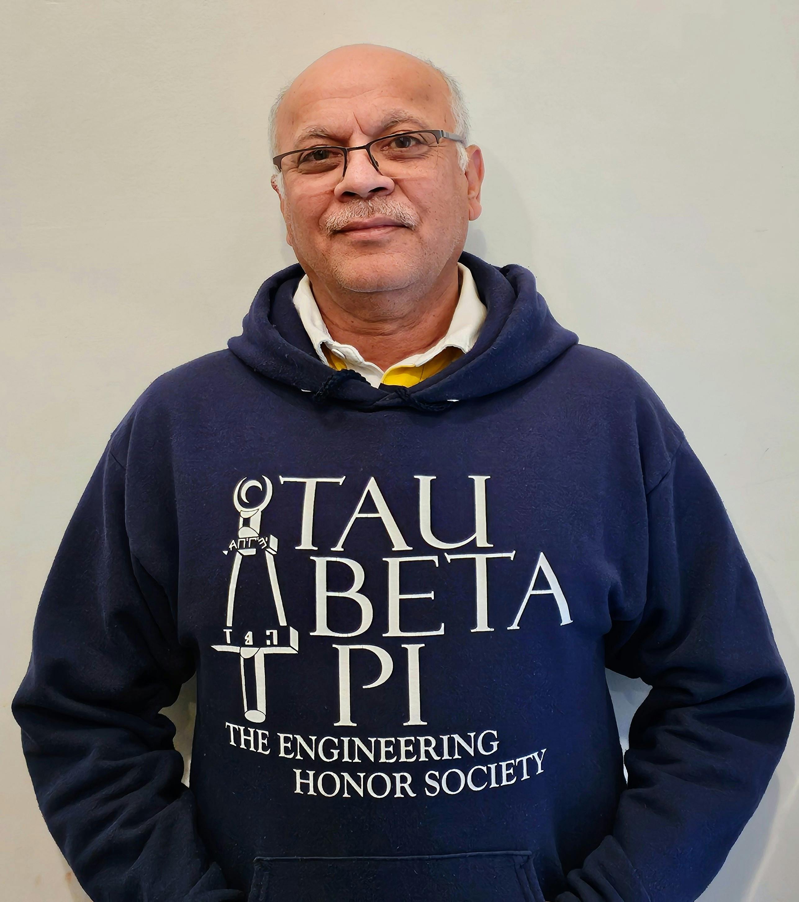 Dr. Murthy wears a sweatshirt representing Tau Beta Pi, the Engineering Honor Society.